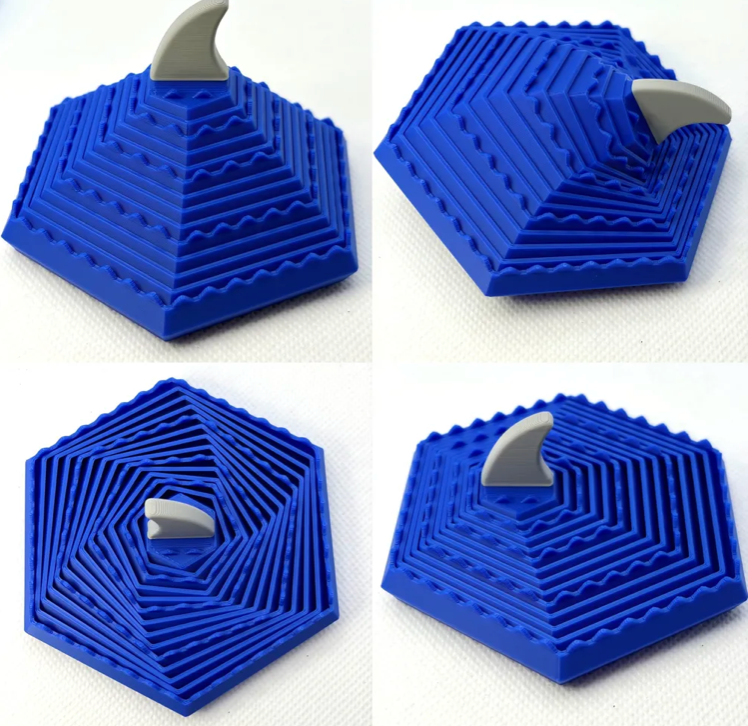 3D printed shark fin wave fidget toy with rotating round layers