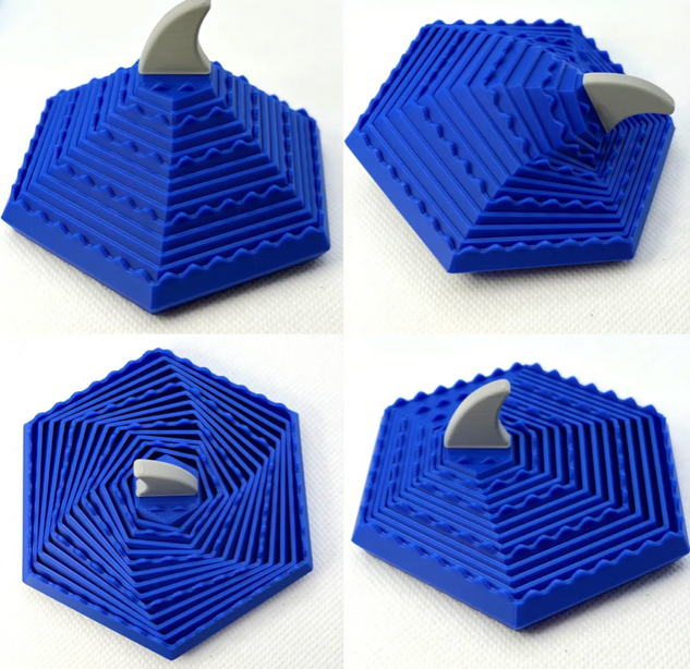 3D printed shark fin wave fidget toy with rotating round layers